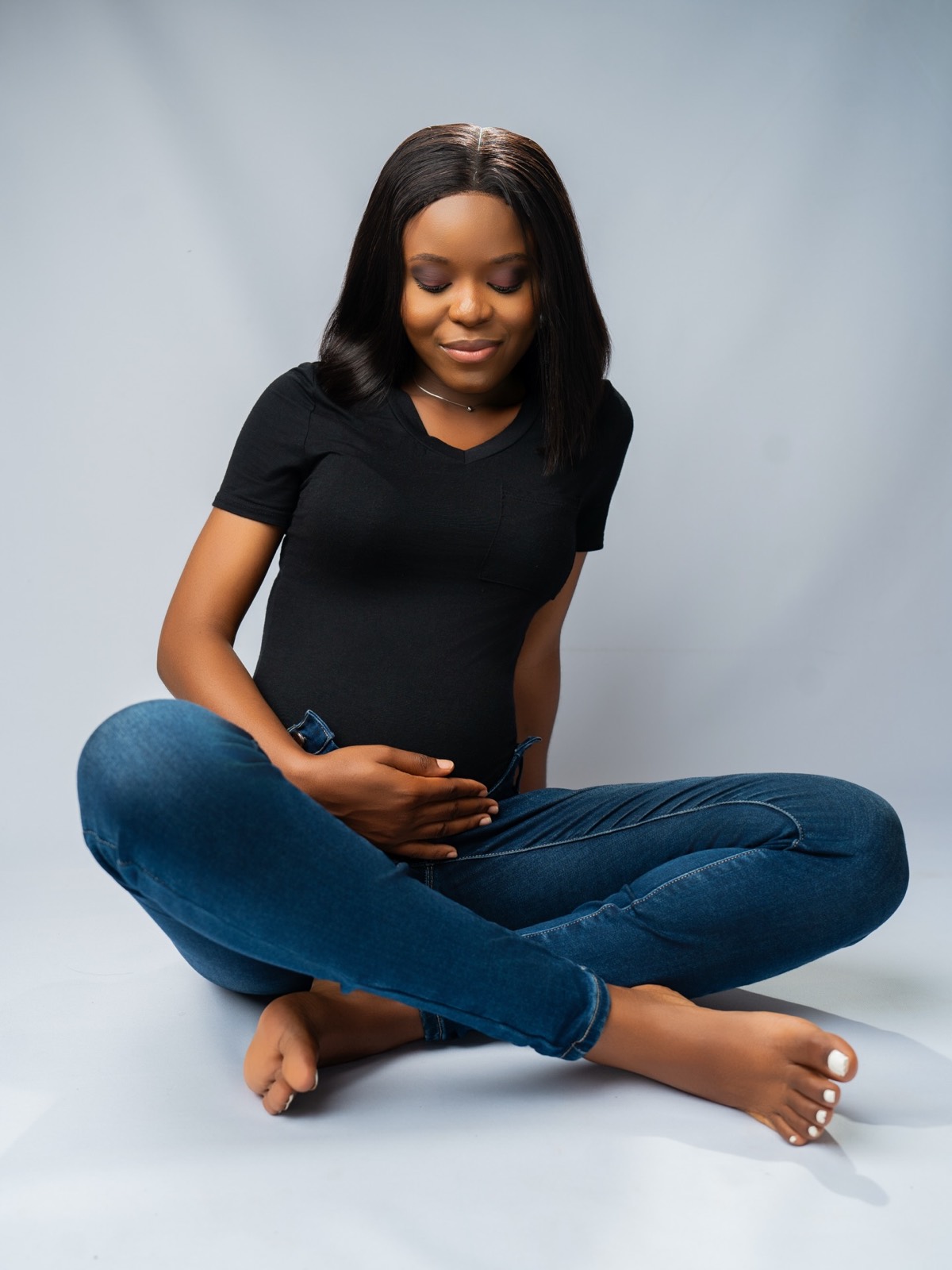 Relaxed studio portrait on a light backdrop