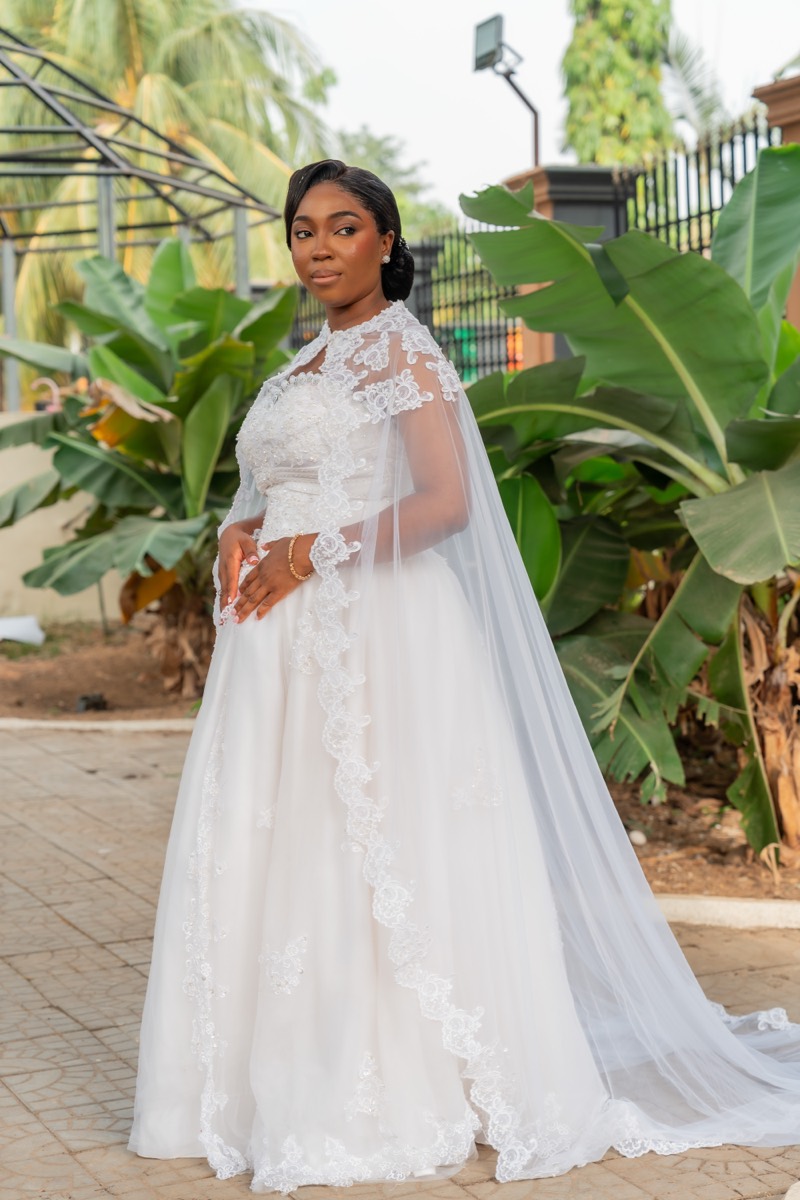 Bride in a garden with a long veil